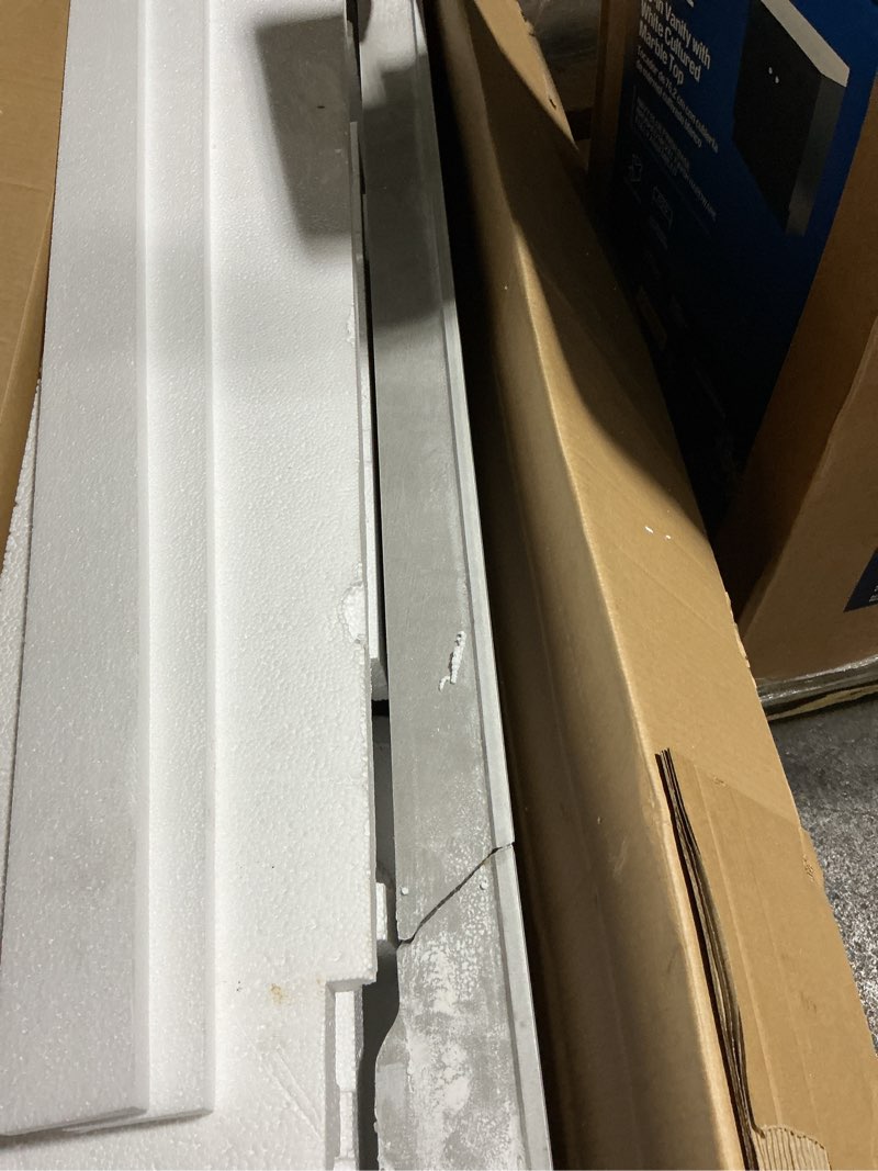 Condition photo showing As Is for (damage cracked)allen + roth dolomiti bianco 49-in white sintered stone single sink bathroom vanity top