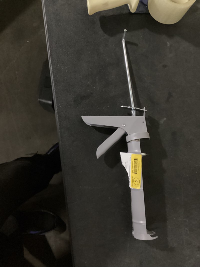 Condition photo showing As Is for project source 10 -oz smooth rod caulk gun