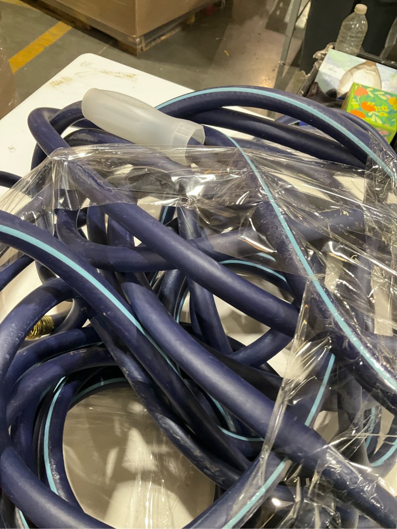 Condition photo showing As Is for heavy-duty dark blue garden hose 