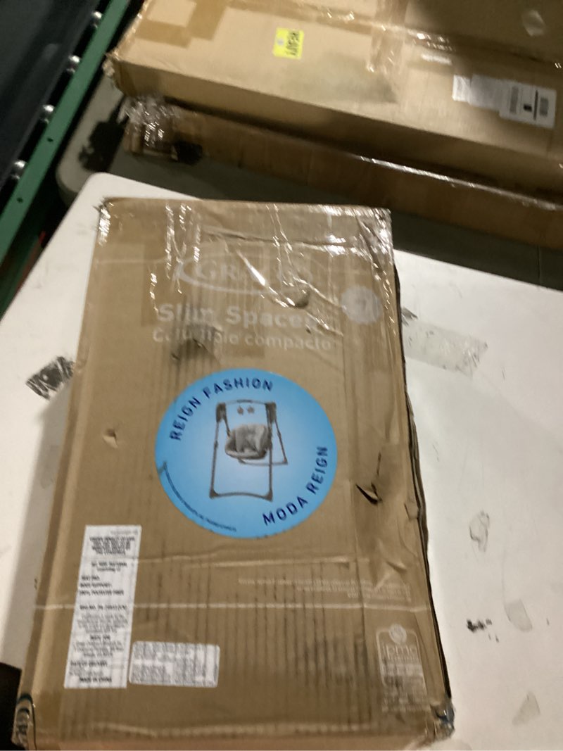 Condition photo showing As Is for graco slim spaces compact baby swing, space saving portable bay swing with height adjustable legs & soft toys, reign