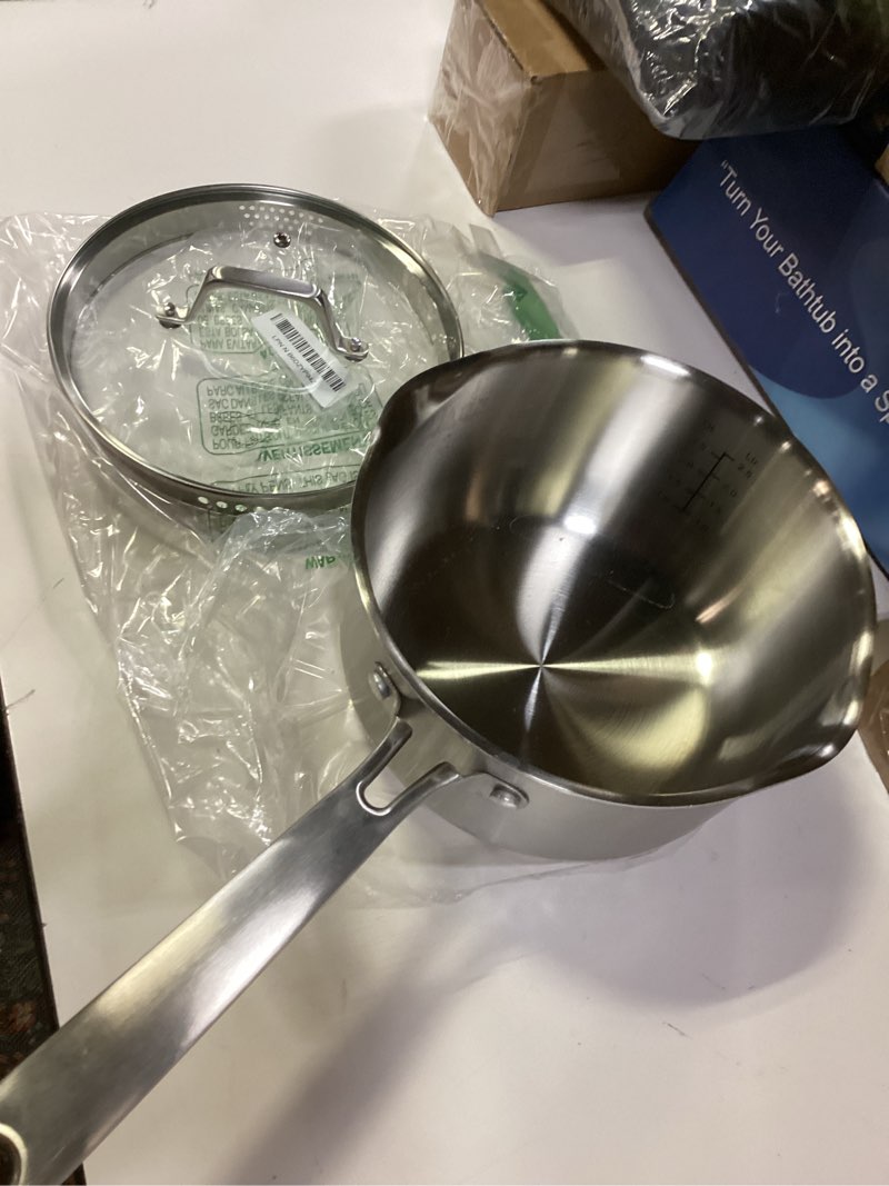 Condition photo showing As Is for PekGema Stainless Steel Saucepan 3 Quart with Glass Strainer Lid, Thicken Tri-ply Full Sauce Pot, Two Side Spouts for Easy Pour, Dishwasher Safe, Induction Ready, Compatible with All Cooktops 3 Quarts
