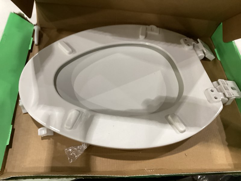 Condition photo showing As Is for toilet seat, slow close, premium moulded wood, quick release, 3d relief texture, 3d animal series, piklids (white puppy, elongated) white puppy elongated, incomplete