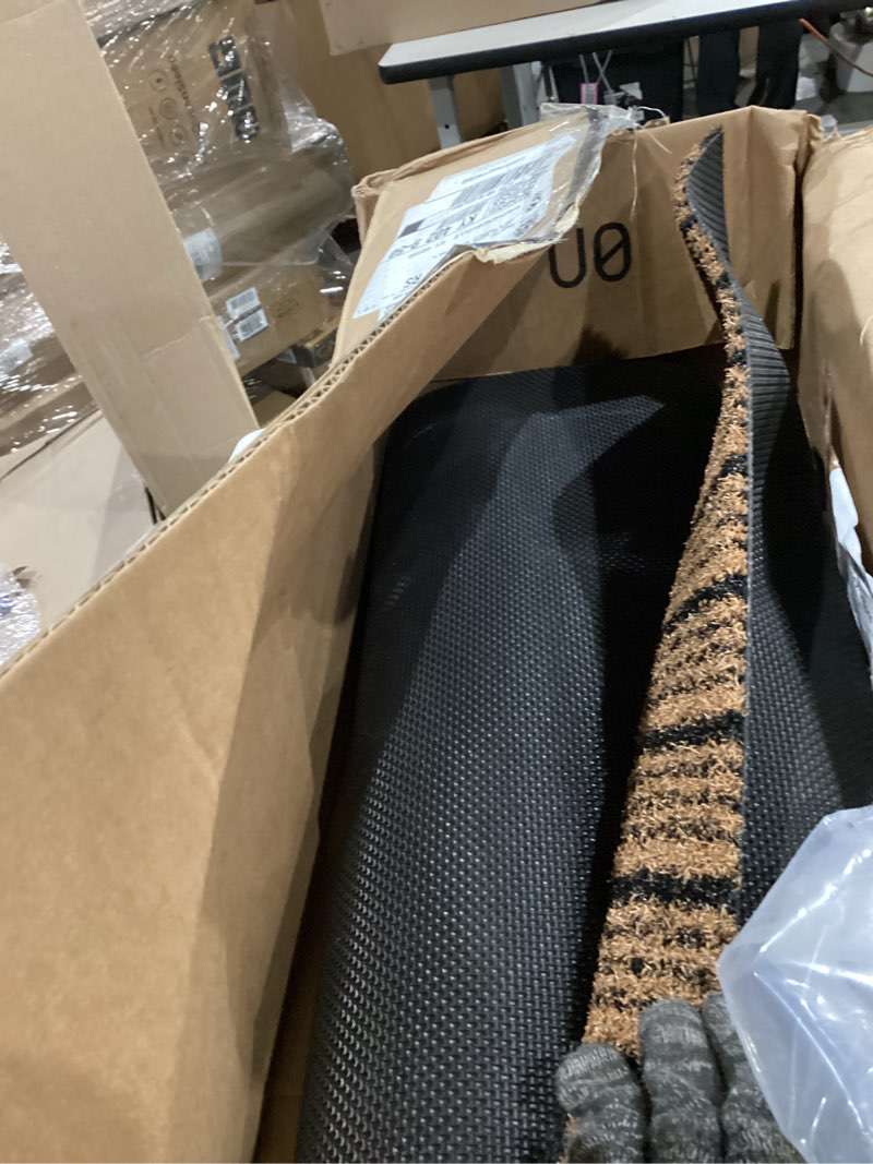 Condition photo showing Good Condition for outside entrance runner rug 32" x 84", dirt trapping outdoor door mat, non slip, water proof, heavy duty commercial rug for patio,garage, traffic area, office, roll packing 32" x 84" beige