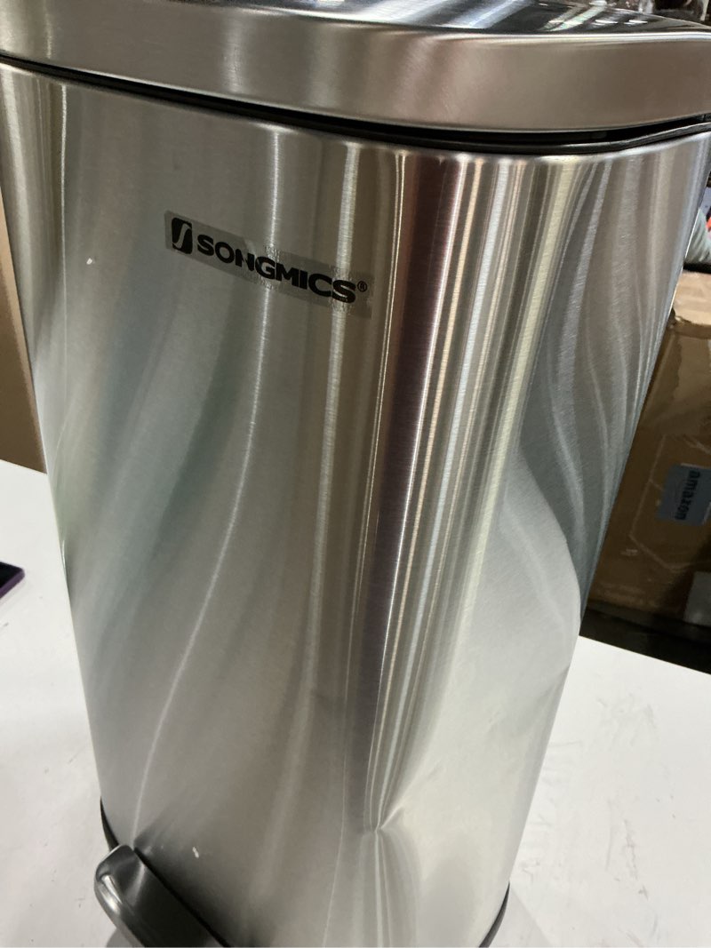 Condition photo showing As Is for songmics trash can with lid, 8 gallon garbage can, stainless steel small waste bin with step pedal and inner bucket, soft close, kitchen, silver ultb03nl silver 8 gal.