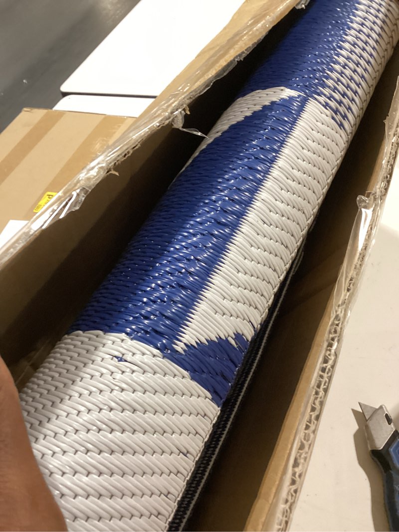 Condition photo showing Good Condition for diikoo outdoor rug mat for patio, 6x9ft waterproof reversible plastic straw rugs, camping carpet area mats for rv, porch, deck, backyard, balcony, camper, trailer, blue & white modern (blue&white) 6 x 9 feet