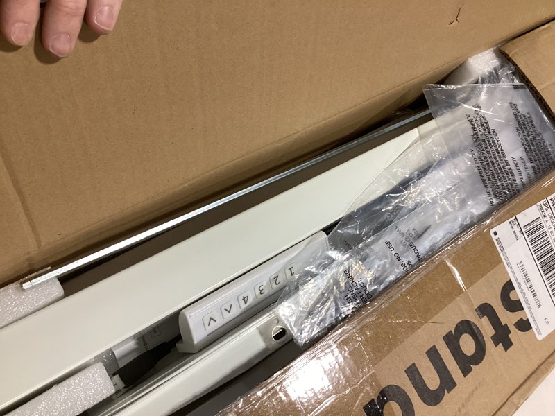 Condition photo showing As Is for HUANUO 32" Small Electric Standing Desk Adjustable Height, 4 Memory Height Settings, Sit Stand Up Desk for Home Office & Computer Workstation, LightWalnut 32" x 19" Light Walnut