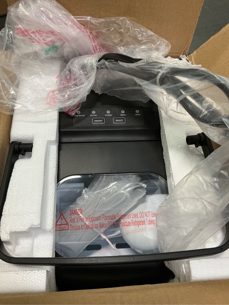 Condition photo showing Good Condition for ecozy Ice Makers Countertop, Portable Ice Machine with Carry Handle, 26lbs in 24Hrs, 9 Ice Cubes Ready in 6 Mins, Auto-Cleaning Ice Maker with Basket and Scoop, for Home/Kitchen/Camping/RV Black Bullet Ice Maker