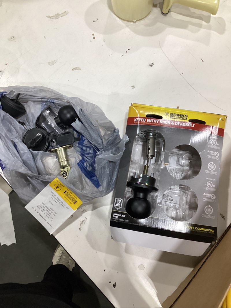 Condition photo showing As Is for brinks commercial matte black knob and deadbolt set 2 in.