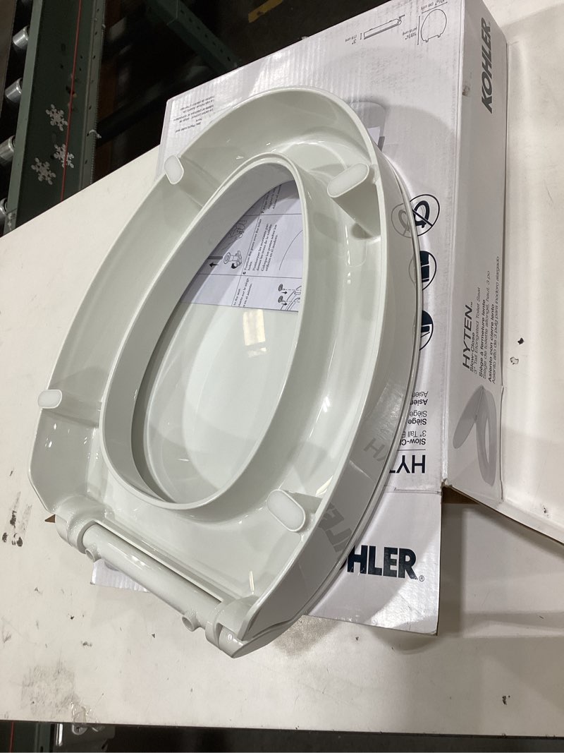 Condition photo showing As Is for KOHLER 25875-0 Hyten 3" Height, Elevated Soft Close Elongated Toilet Seat, Contoured Seat with Grip-Tight Bumpers, Quick-Attach Hardware, No Slam Toilet Seat, White White Elongated