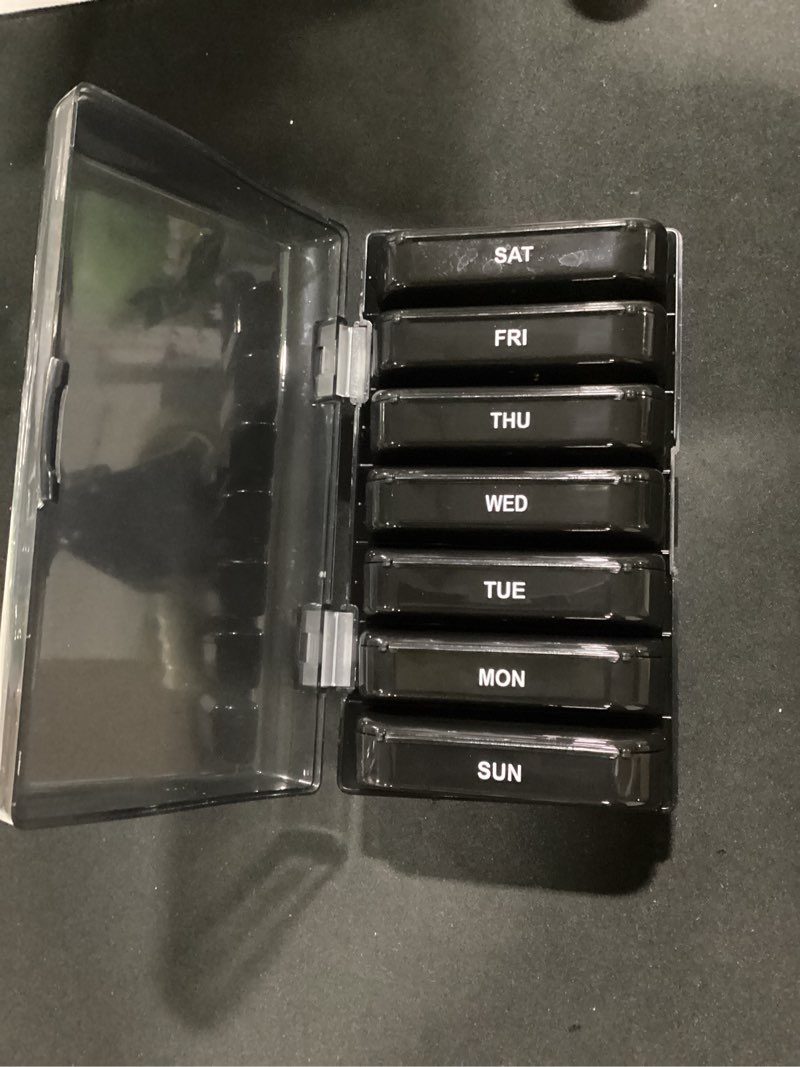Condition photo showing Good Condition for puliv weekly pill organizer with large capacity, dual protection pill box 7 day, arthritis friendly pill case easy to open, medicine organizer for vitamins, medications, fish oils, supplements (black)