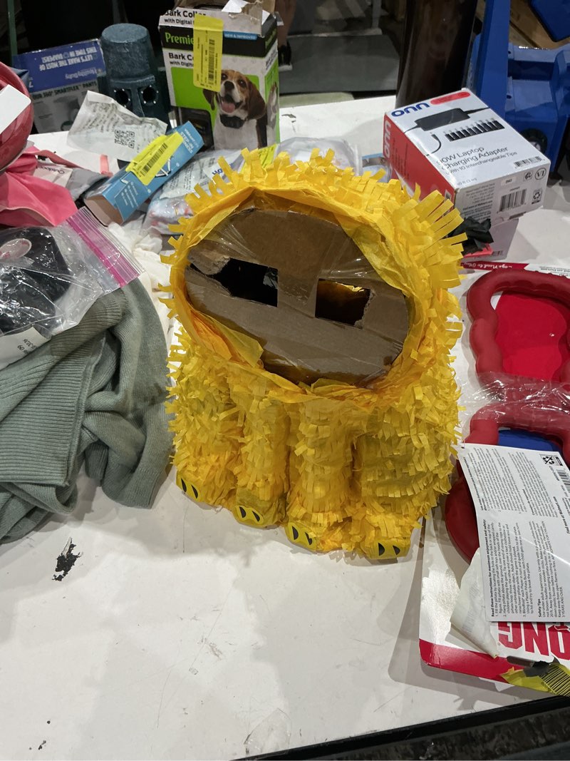 Condition photo showing As Is for yellow/brown lion party pinata, 10.25" x 15", by way to celebrate