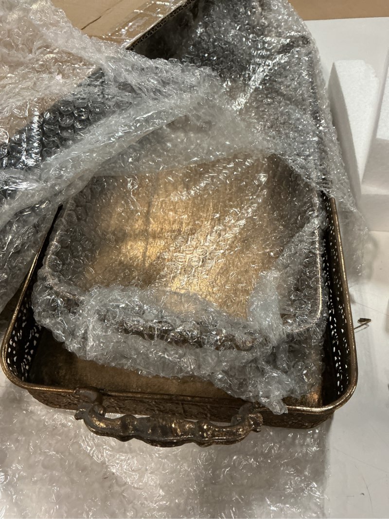Condition photo showing New/Like New for vintage gold serving tray set with handles, decorative ottoman & coffee table tray for living room, vanity or bathroom, 2-piece antique style nesting metal trays with hollow carved edge