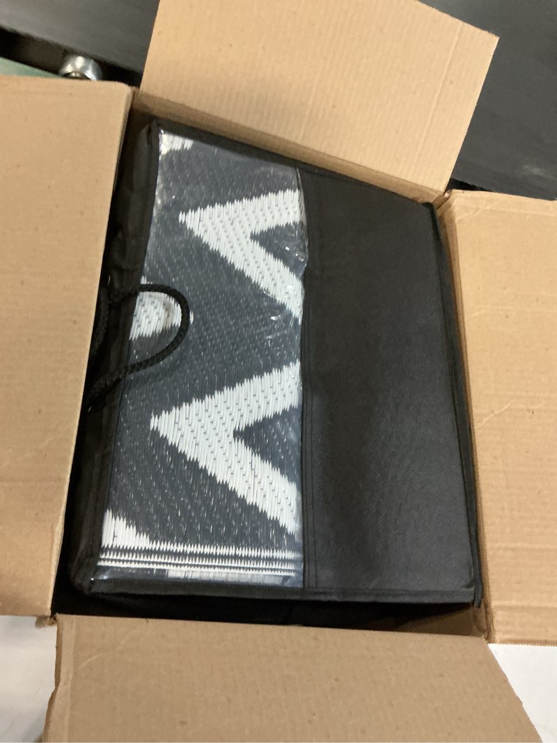 Condition photo showing New/Like New for olanly waterproof outdoor rug 5x8 ft clearance, reversible outdoor plastic straw rug, rv mat, indoor outdoor carpet for patio, camping, balcony, deck, backyard, black & white black & white chevron 5' x 8' (rectangular)