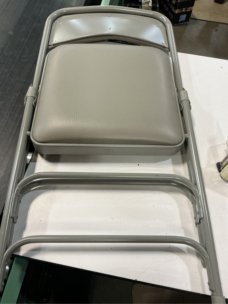 Condition photo showing Good Condition for grey vinyl padded seat stackable folding chair 