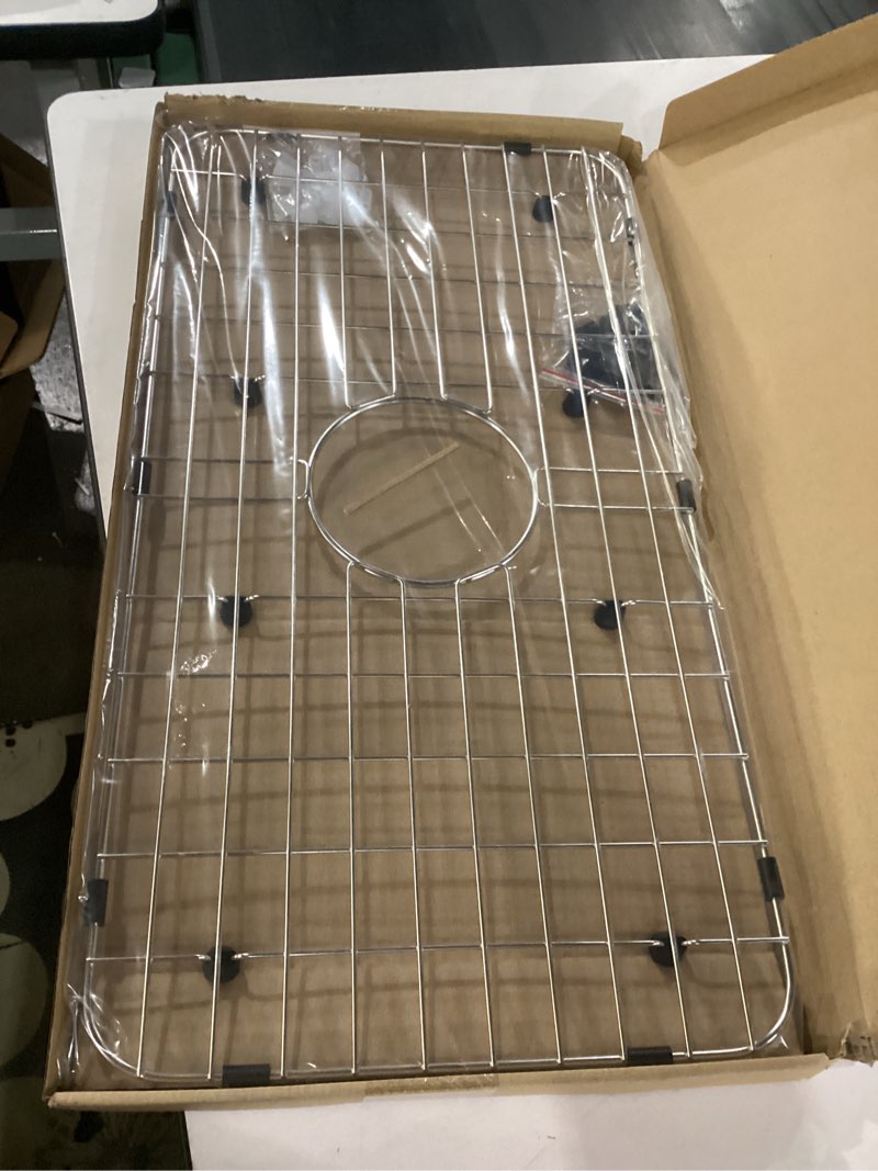 Condition photo showing Good Condition for serene valley sink bottom grid 24-1/8" x 12-5/8", centered drain with corner radius 1-1/2", sink protector nlw2412c