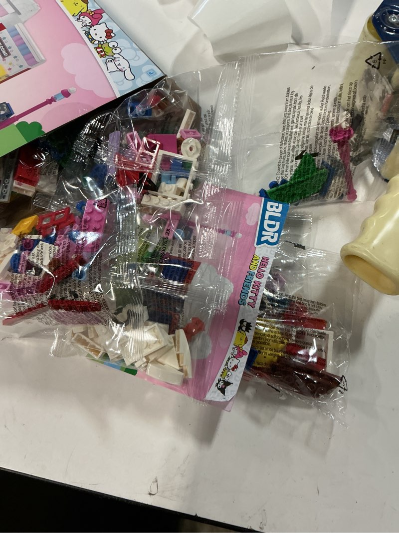 Condition photo showing As Is for bldr hello kitty and friends, hello kitty’s dream cafe building set 0076 with hello kitty, cinnamoroll, and pompompurin minifigures - gift for kids and sanrio fans ages 8+