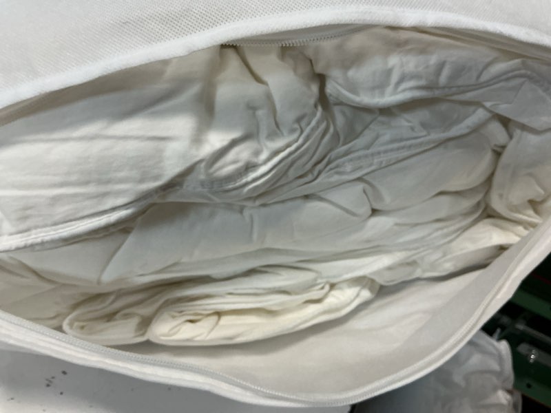 Condition photo showing As Is for premium down alternative comforter king / cal king 