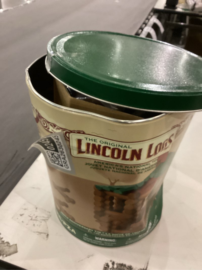 Condition photo showing As Is for Lincoln Logs 100th Anniversary Tin
