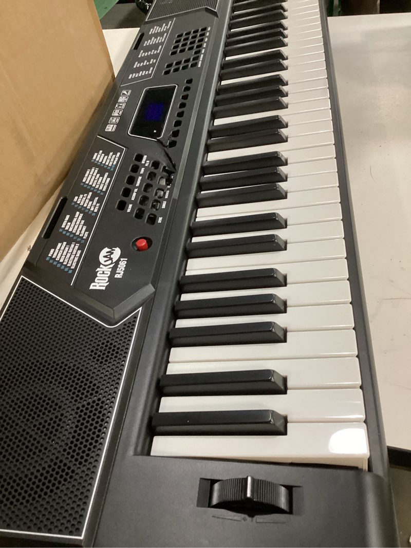 Condition photo showing As Is for rockjam 61 key keyboard piano stand with pitch bend kit, piano bench, headphones, simply piano app & keynote stickers 61 key kit with pitch bend