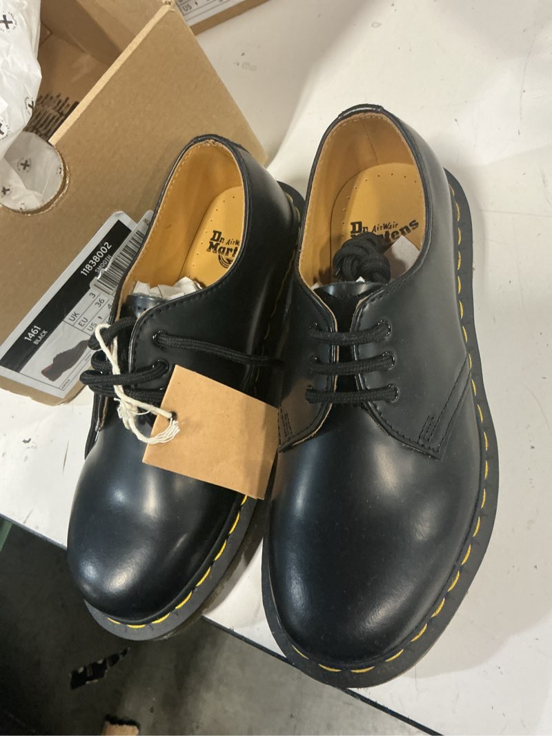 Condition photo showing New/Like New for dr. martens men's 1461 ys 4/ 5