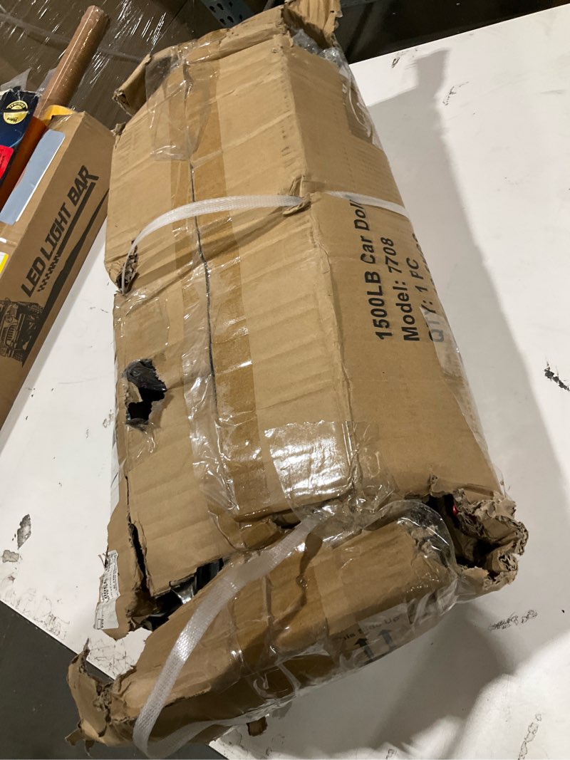 Condition photo showing As Is for sunex 1500-pound wheel dolly