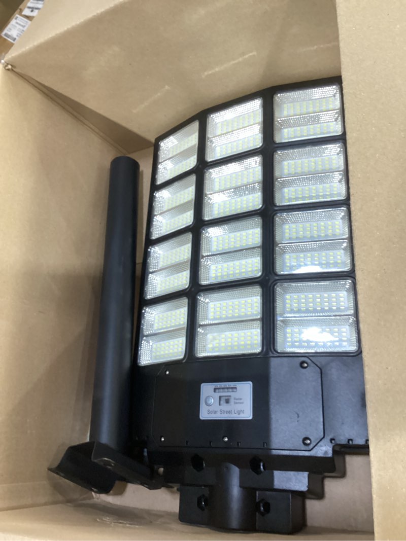 Condition photo showing As Is for **similar too **solar lights outdoor waterproof, 8000w solar street light with motion sensor, 7000k dusk to dawn security flood lights ip66, commercial outdoor lighting for parking lot, yard, driveway, farm 8000w 1pack