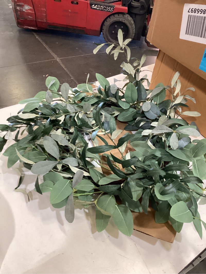 Condition photo showing As Is for artificial green eucalyptus wreath incomplete