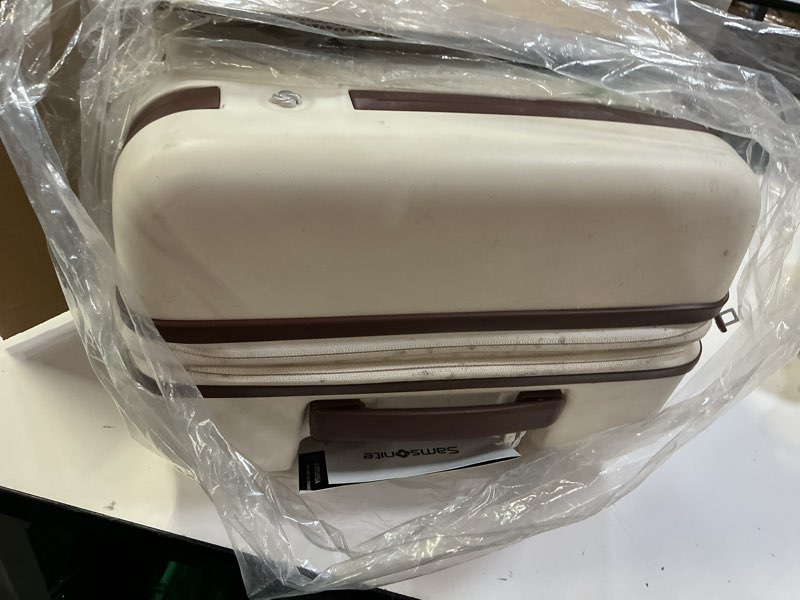 Condition photo showing As Is for Virtuosa Hardside 21 Inch Carry On Luggage - Airline Approved with 360° Spinner Wheels, RightHeight™ Adjustable Handle - Zippered WetPak™ - TSA Lock - Expandable Light Polycarbonate Shell - Off White Carry-on Spinner Off White