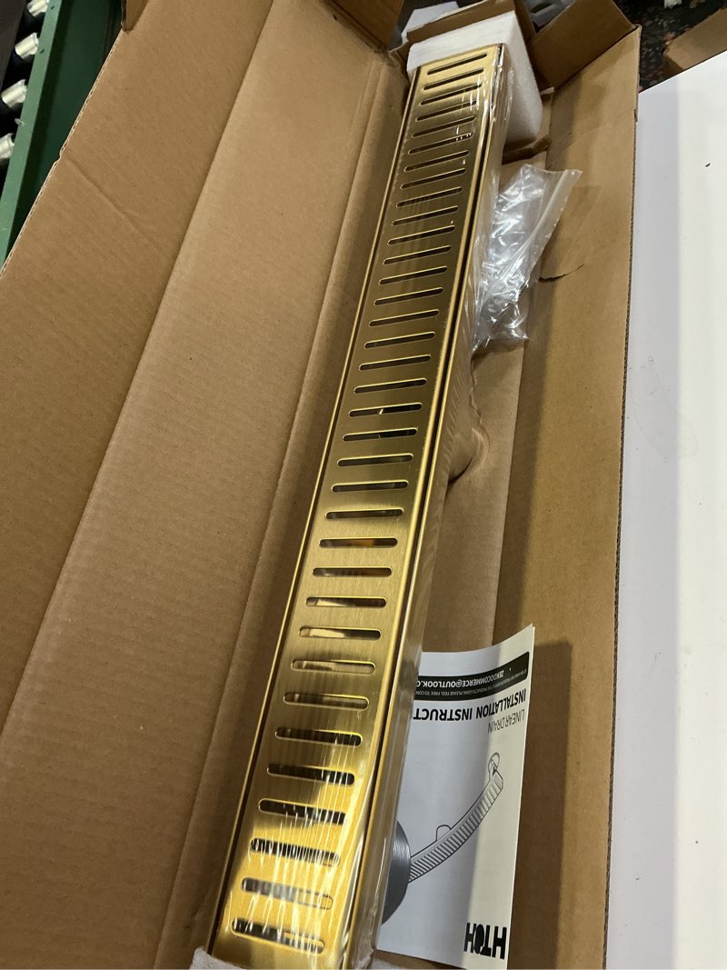 Condition photo showing Good Condition for HTOH Gold Shower Drain, 304 Stainless Steel Linear Shower Drain 24 Inch with Removable Capsule Pattern Grate - Adjustable Rectangular Brushed Shower Floor Drain with Hair Strainer, Linear Drain Brushed Gold 24 inch