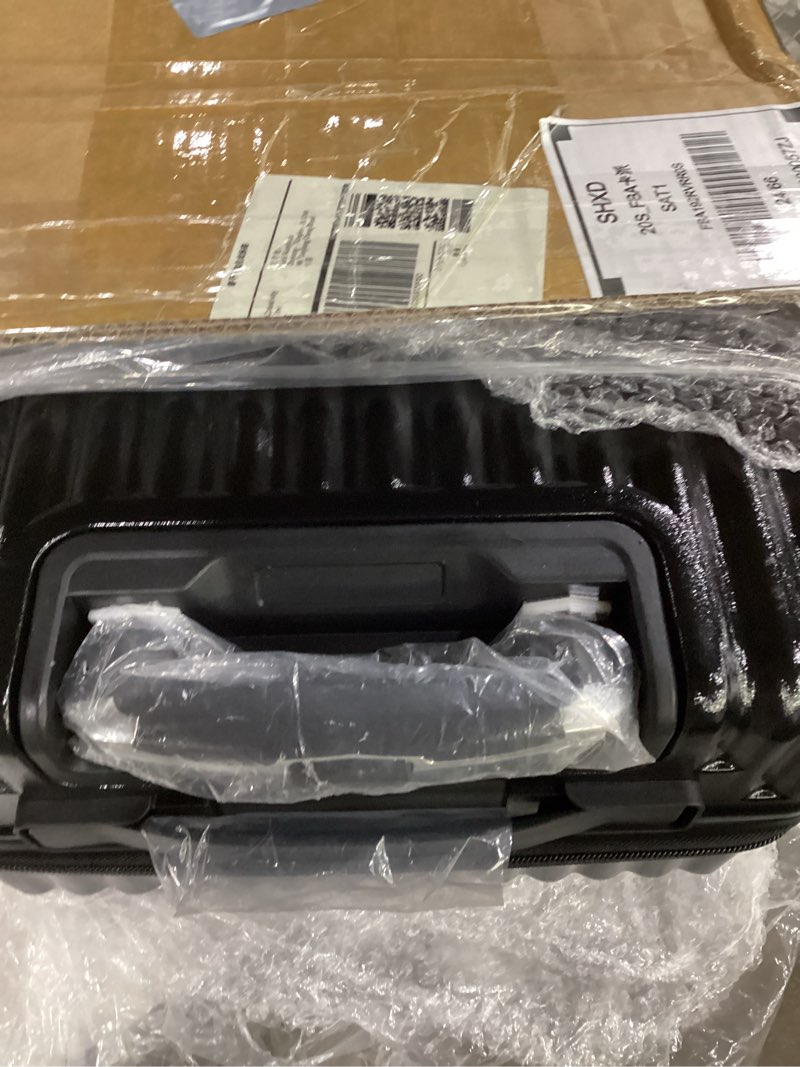 Condition photo showing New/Like New for Black rolling suitcase hard plastic