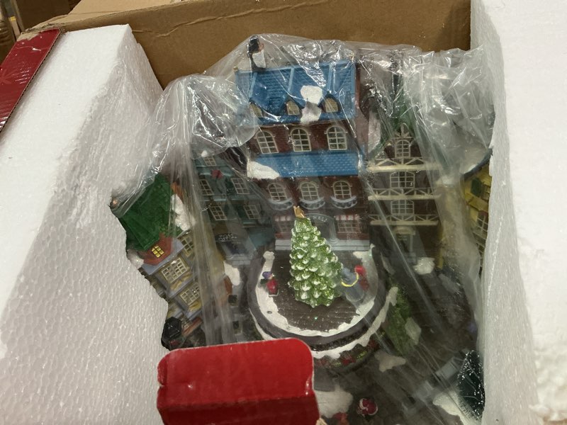 Condition photo showing Good Condition for Christmas Village House, 12.4" H Large Size, Colourful LED Lights with Christmas Music, Rotating Christmas Trees and Roller Skaters, Christmas Decoration for Home (Yellow) 24-villagetree