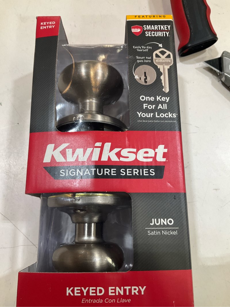 Condition photo showing As Is for juno satin nickel entry door knob featuring smartkey security with microban antimicrobial technology