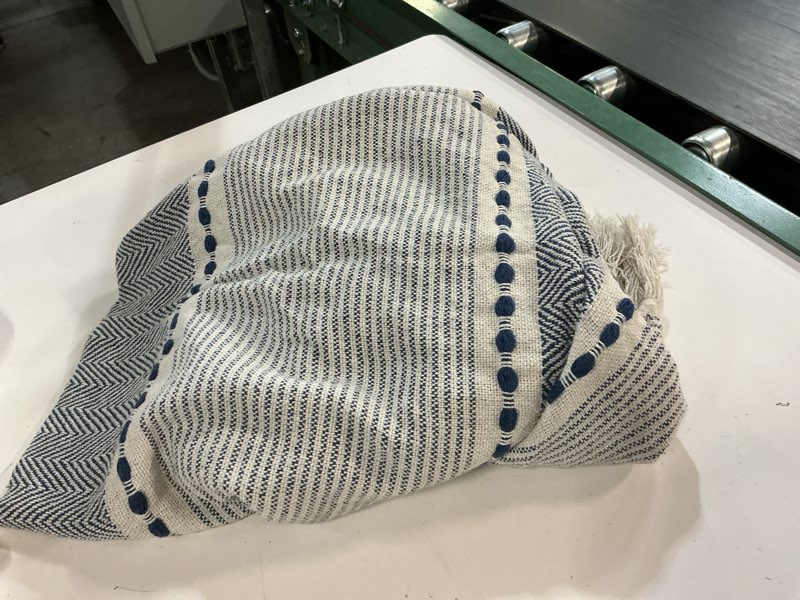Condition photo showing As Is for Lush Decor Herringbone Stripe Woven Tassel Yarn Dyed Cotton Tassel Throw Blanket 50" W x 60" L Navy & White - Striped Throw Blankets - Blue Couch Blanket Herringbone Stripe Navy 50" x 60"