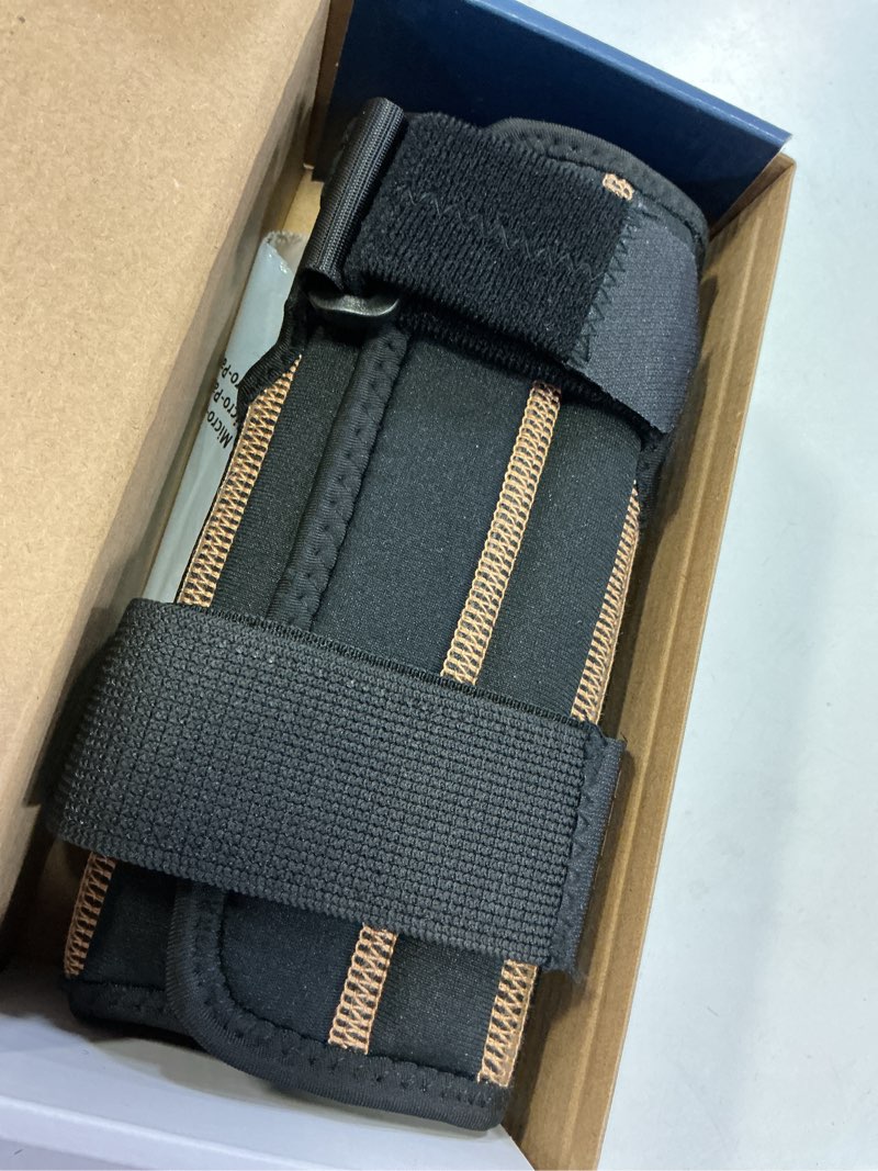 Condition photo showing Good Condition for rapid relief one size fits most wrist brace in black