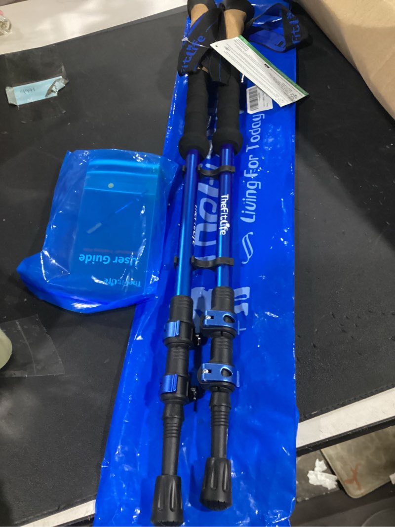 Condition photo showing New/Like New for thefitlife trekking poles - lightweight 7075 aluminum hiking sticks with cork grips, adjustable telescopic design, metal flip lock for men & women - perfect for hiking, walking, camping & backpacking blue