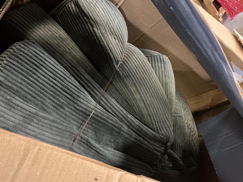 Condition photo showing As Is for Grey courdury sectional(incomplete cushion only)