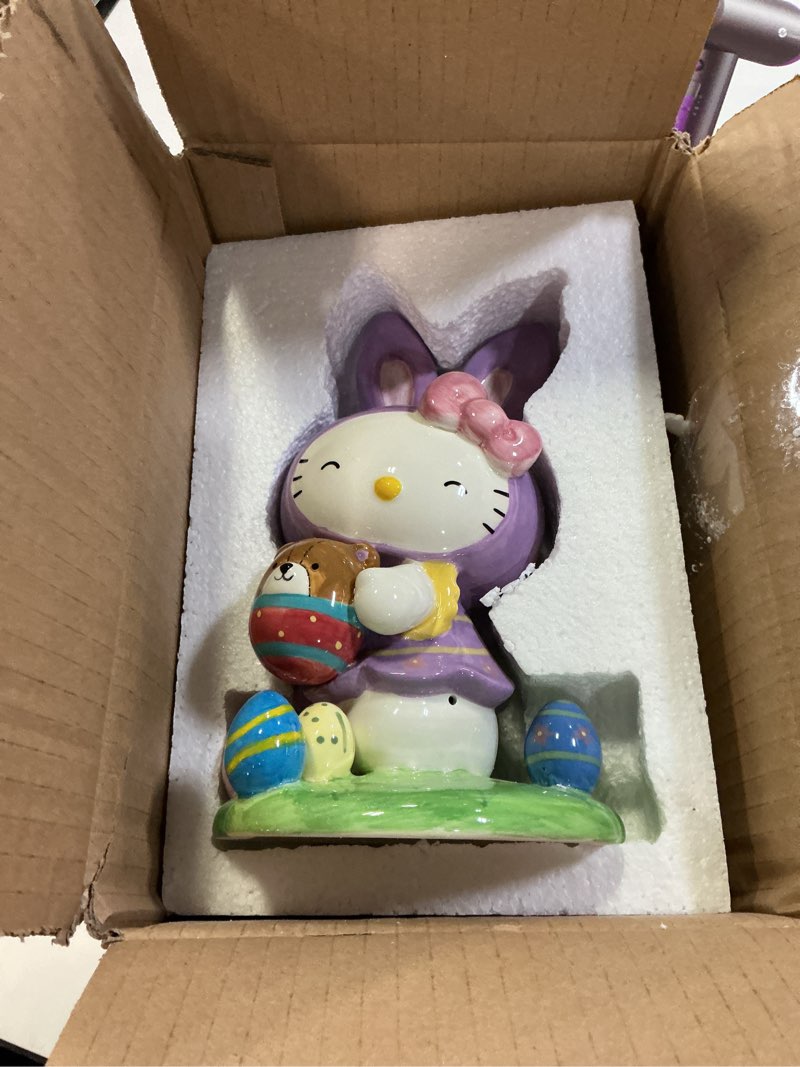 Condition photo showing New/Like New for Blue Sky Clayworks Hello Kitty Easter Purple Bunny Figurine, Ceramic, 5" L x 4.5" W x 8" H, Spring Egg Hunt Cheer