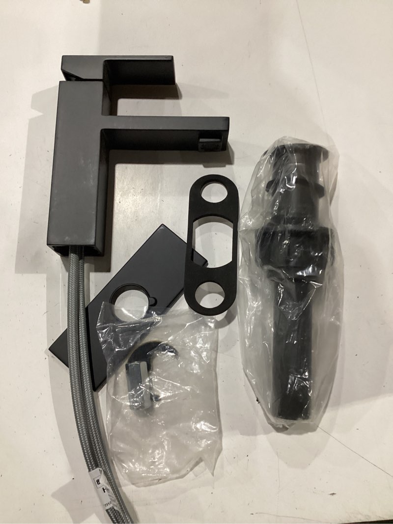 Condition photo showing As Is for moen revyl matte black one-handle single hole modern bathroom sink faucet with optional deckplate and spring loaded drain assembly, 84771bl