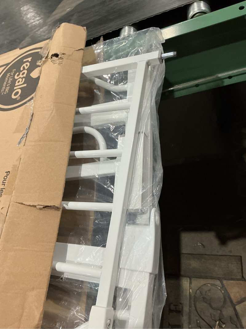 Condition photo showing As Is for regalo safety 36" extra tall baby gate for doorways & bottom of stairs, pressure mounted walk through gate for babies, toddlers & pets, tested & safe for 30 years, american designed, american owned white 29-36.5"w x 36"h