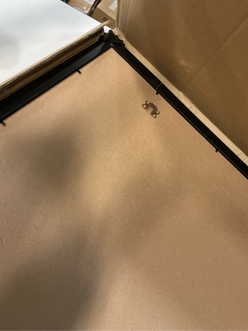 Condition photo showing As Is for lavie home 22 x 30 poster frame black, display pictures 18x27 with mat or 22x30 without mat, stable and sturdy picture frame and polished plexiglass, horizontal and vertical format of the wall?1 pack? 22x30 black