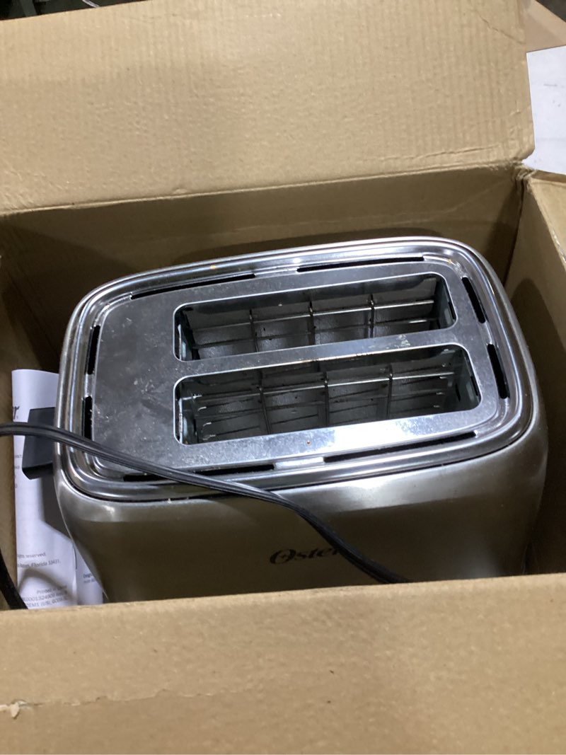 Condition photo showing As Is for oster 2 slice toaster stainless steel