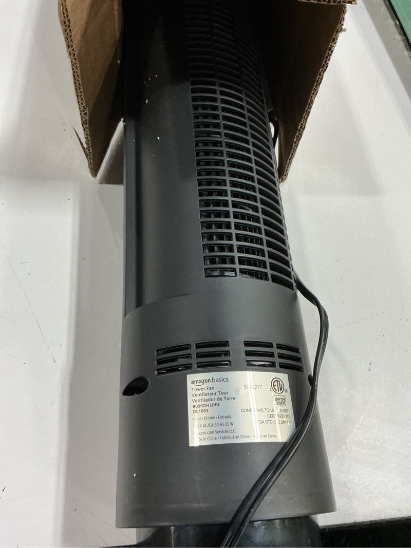 Condition photo showing As Is for Amazon Basics 28" 60-Degree Oscillating Tower Fan for Bedroom, Living Room, Office, With 3 Speeds, Intuitive Mechanical Control, Black, 35W, 27.8"H x 9.4"D x 9.4"W 28" - Mechanical Control