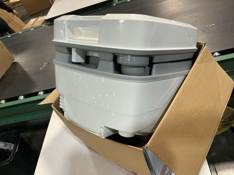 Condition photo showing As Is for thetford campa-potti mt, 4-gal portable toilet, length 16.8 x width 15.1 in x height 13 in.