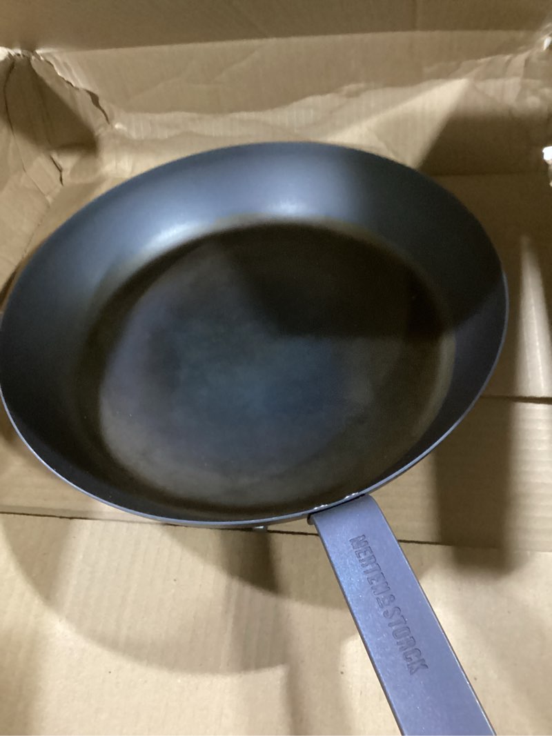 Condition photo showing Good Condition for Merten & Storck Pre-Seasoned Carbon Steel 12” Frying Pan Skillet, Use on Induction, Stove and Grill, Durable, Even-Heating, for Searing, Grilling, Oven Use, and Campfire, Indoor/Outdoor 12" Frying Pan Skillet Black