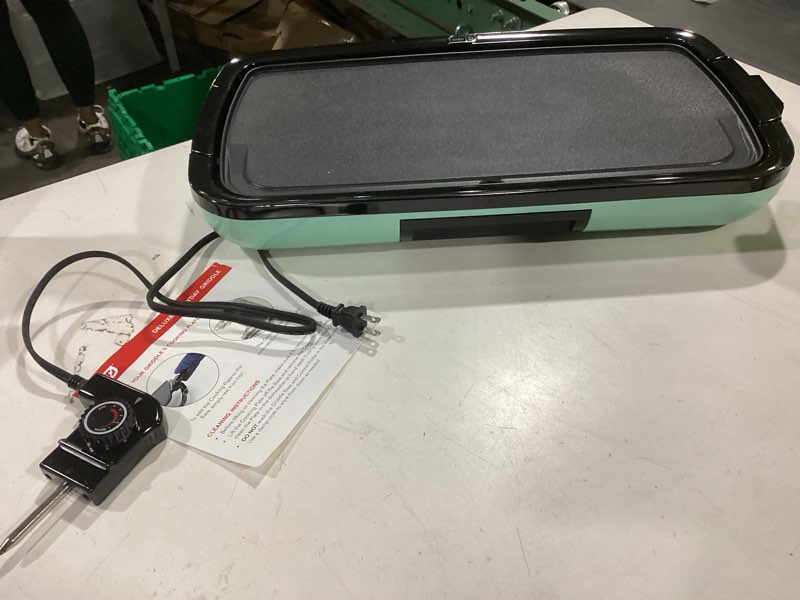 Condition photo showing As Is for dash deluxe everyday griddle - electric griddle with removable plate - nonstick, easy-clean surface & anti-slip base - recipe book included - aqua