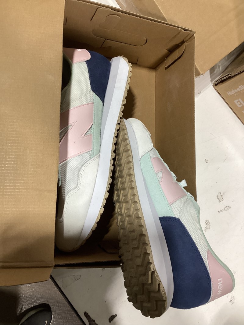 Condition photo showing As Is for new balance women's 237 v1 sneaker reflection/rose sugar 12
