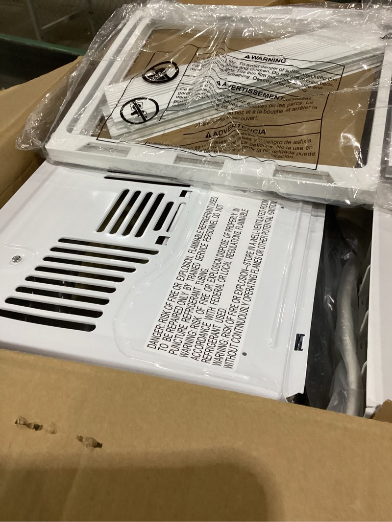 Condition photo showing As Is for not testedge window air conditioner unit, 5,000 btu for small rooms up to 150 sq ft. with manual adjustable fan and cooling settings, perfect for small bedroom or living room, easy install kit included, white new 5,000 btu mechanical controls white