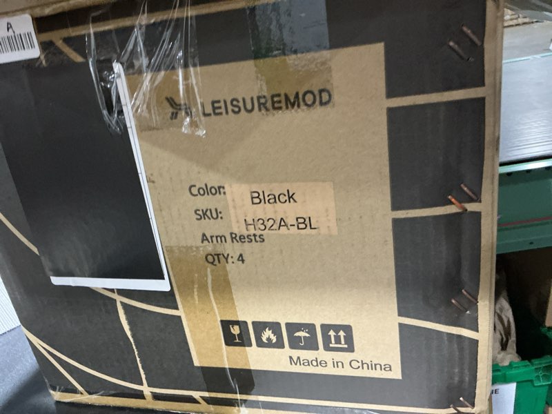 Condition photo showing As Is for leisuremod black arm rest. qty 4