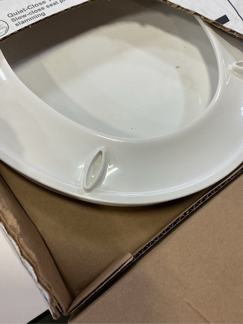 Condition photo showing As Is for kohler 20111-0 brevia, slow close toilet seat, round toilet seat, grip-tight bumpers quick-attach hardware, white