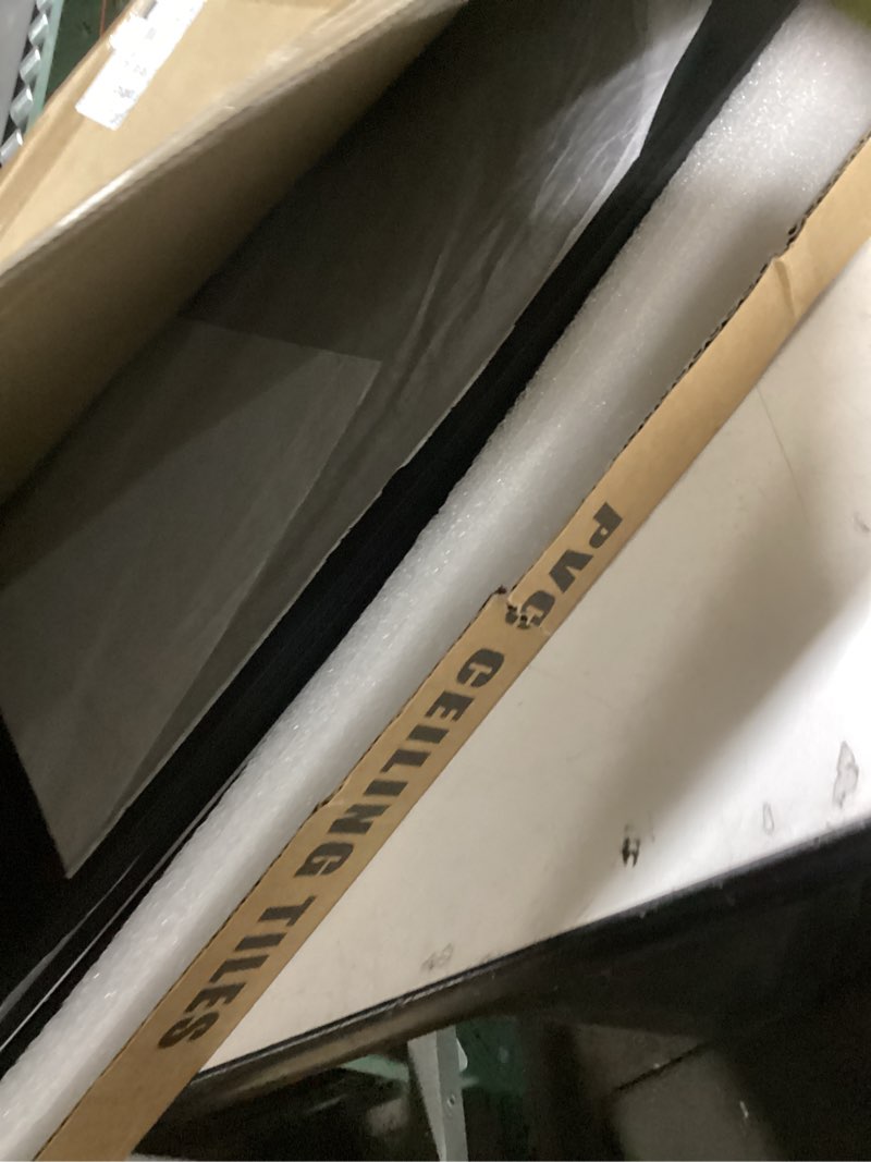 Condition photo showing Good Condition for 2ft x 2ft Drop Ceiling Tiles?Smooth Black PVC Ceiling Tiles 24 x 24in. Waterproof, Washable and Fire-Rated - Reusable - High-Grade PVC to Prevent Breakage-Package of 12 Tiles Black 2ftx2ft